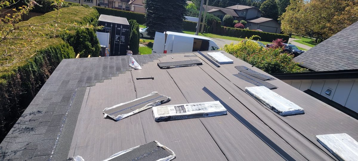 Asphalt shingles going on over new underlayment