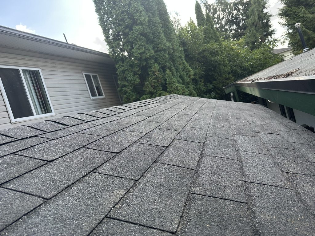 Close-up of new asphalt shingles & ridge