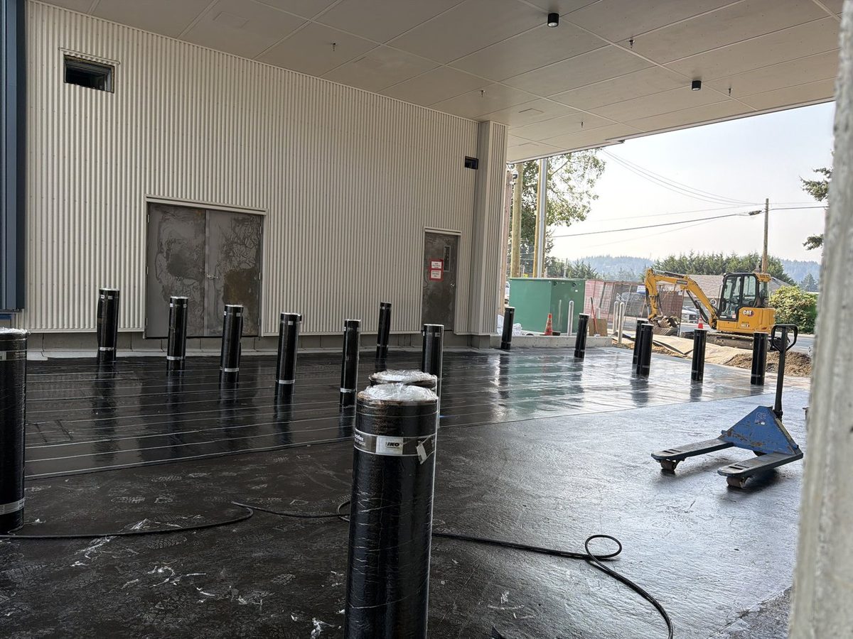 Torch-on base sheet on a covered deck with pipe penetrations