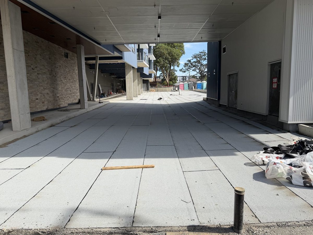 Finished granulated torch-on cap sheet across the covered deck