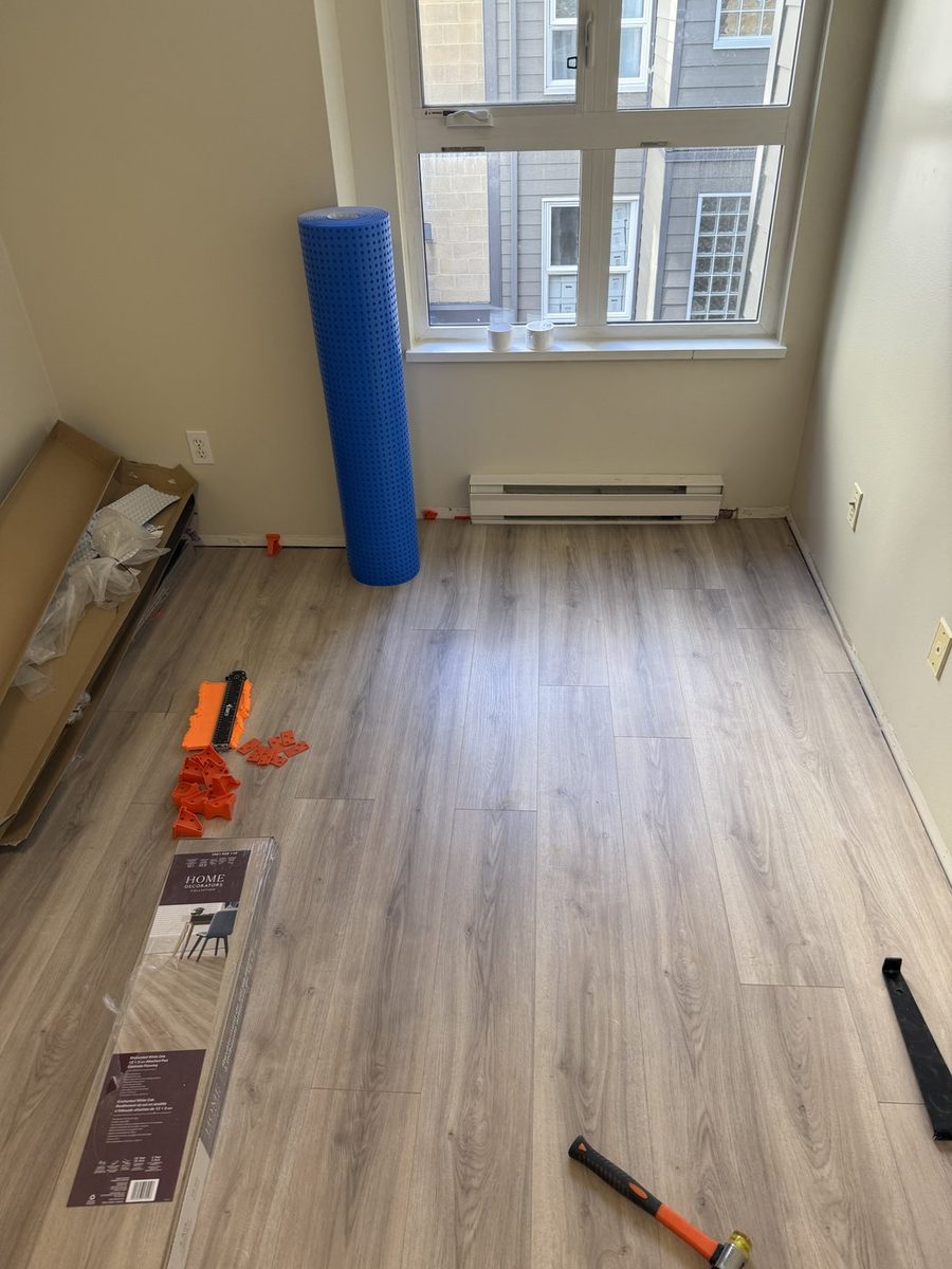 Finished vinyl plank floor in a bright bedroom