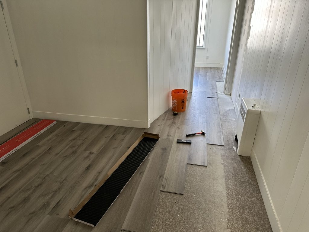 Vinyl plank flooring partway through installation