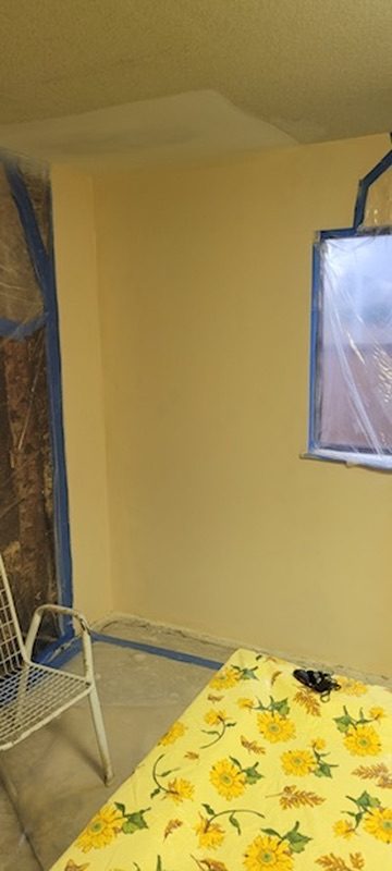 Repaired wall masked & ready for paint