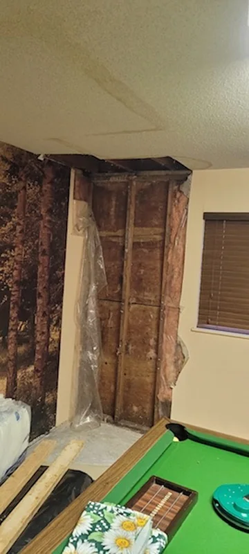Interior wall and ceiling opened for investigation and repair